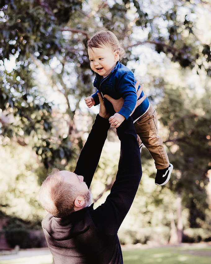 Daddy and Baby Flying, birthday photo session at Poinsettia, LA.