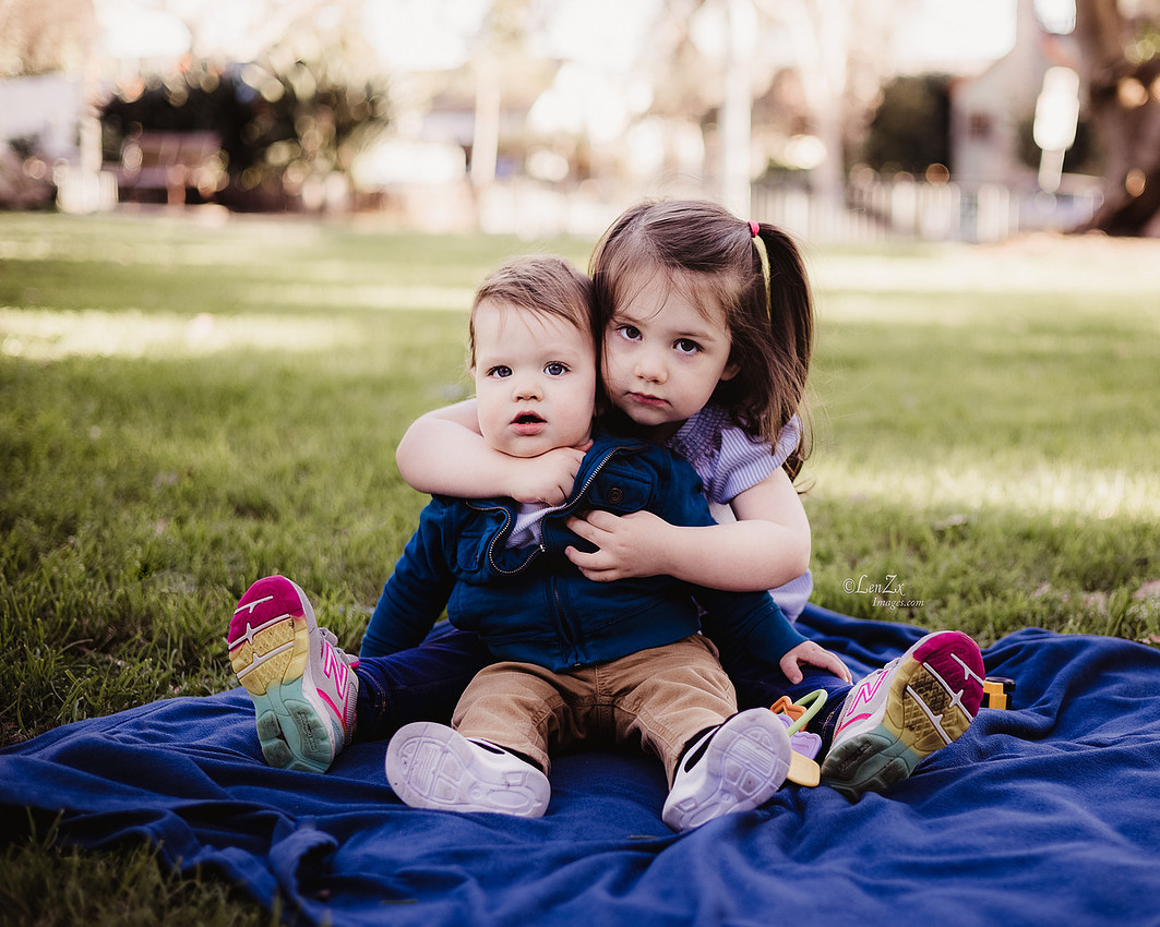 Little brother, the big sister in the first birthday photo session at Poinsettia, LA.